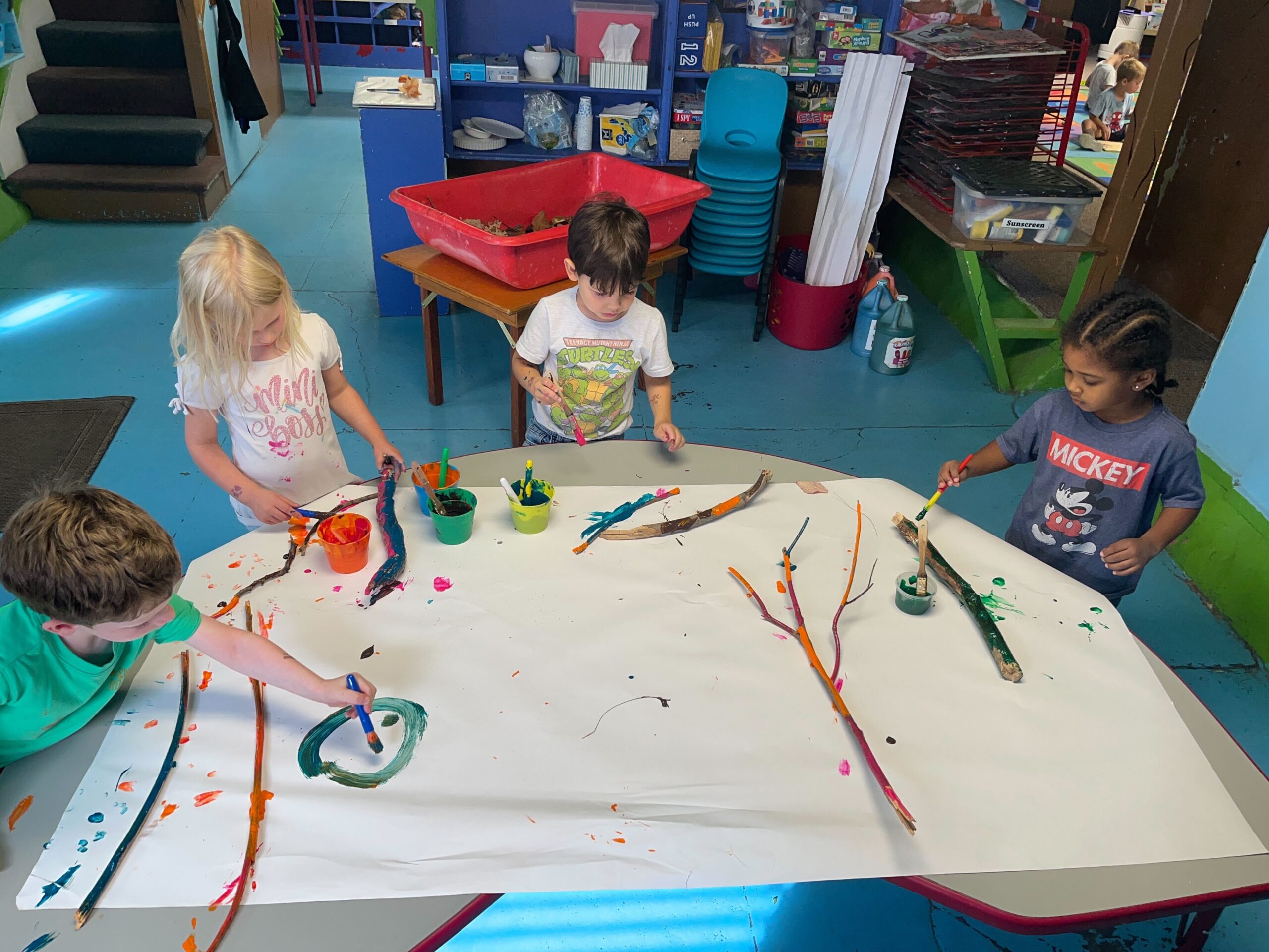 IMG_4235 Children sitting on an alphabet carpet playing game